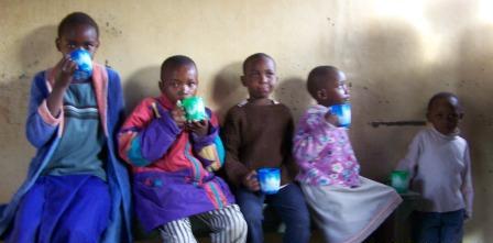 Kids drinking warm beverages - Mt. Kenya as seen from Mweiga